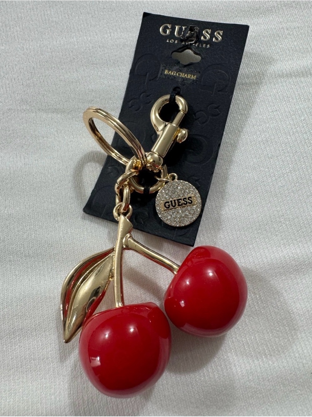 GUESS Cherry Bag Charm and Keychain in Gold Tone